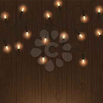 Garland light, Christmas decoration on a wooden background