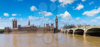 The Big Ben, the Houses of Parliament and Westminster bridge in London in a beautiful summer day, England, United Kingdom