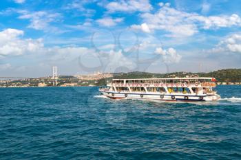Passenger ship and Bosphorus Bridge in the Gulf of the Golden Horn in Istanbul, Turkey in a beautiful summer day
