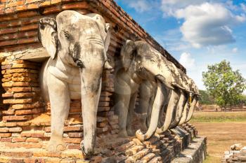 Wat Sorasak Temple (Elephant Temple) in Sukhothai historical park, Thailand in a summer day