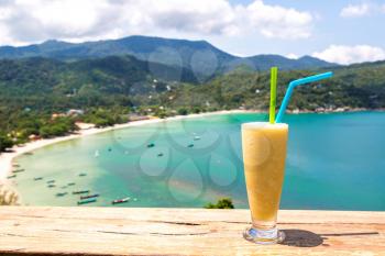 Fresh organic mango shake in restaurant on Ao Thong Nai Pan Noi beach on Koh Phangan island, Thailand in a summer day