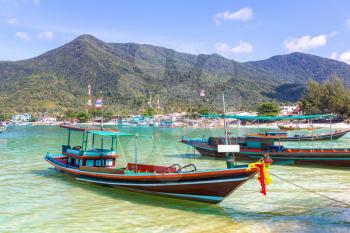 Traditional wooden fisherman boat on Koh Phangan island, Thailand in a summer day