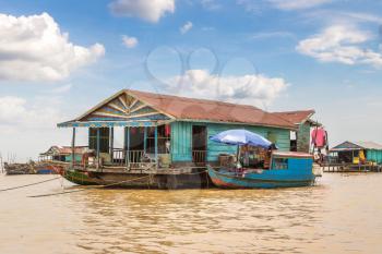 Chong Khneas floating village near Siem Reap, Cambodia in a summer day