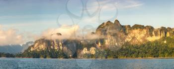 Panorama of Beautiful nature at Cheow Lan lake, Ratchaprapha Dam, Khao Sok National Park in Thailand in a summer day