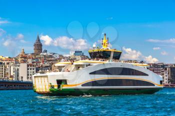 Passenger ship  and Galata Tower and Gulf of the Golden Horn in Istanbul, Turkey in a beautiful summer day