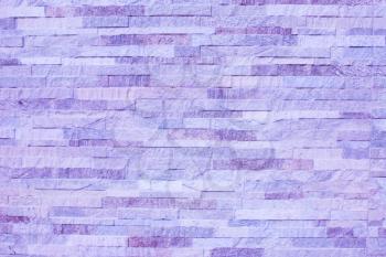 Purple old stone background. Purple wall texture.
