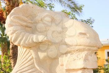 Statue of ram-headed sphinx and pharoah