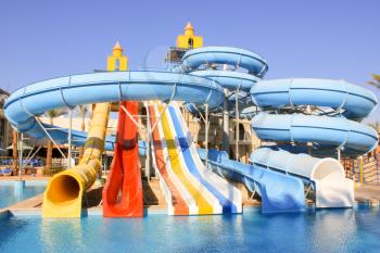 Water Slides at the Water Aquapark. Water Park for Kids at Sun Light. 