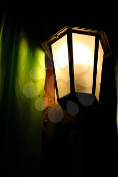 Night lamp on the blackboard and curtains. Romantic scene