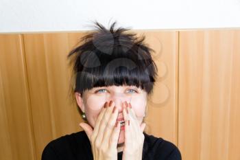 Portrait of European smiling woman with black hair