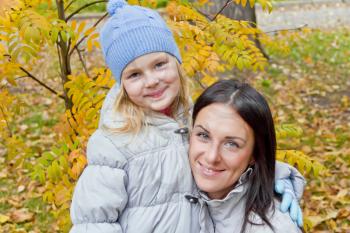 Photo of mother and daughter in autumn