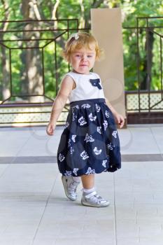 Cute baby girl with curly blond hair