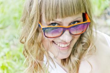 Portrait of smiling girl with orange sunglasses