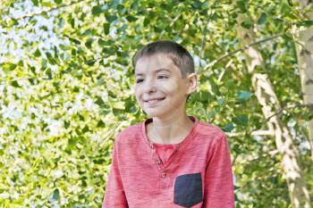 Horizontal portrait teenager boy in pink on green background