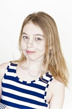 Cute girl eleven years old with blond long hair on white background