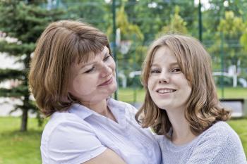 Happiest mother and daughter fourteen years old in summer time