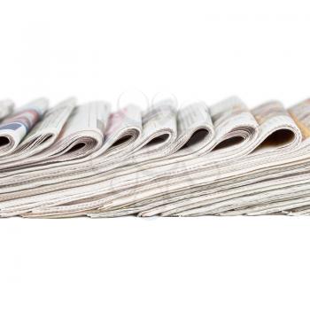 Assortment of folded newspapers isolated on white