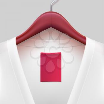 T-shirt with label hanging on a hanger. The template for your design or advertising messages.
