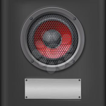 Sound speaker with metal plate on dark background.