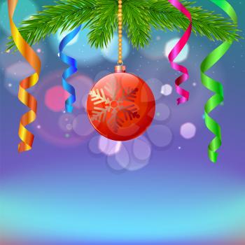 New year composition with serpentine and Christmas ball on blurred background