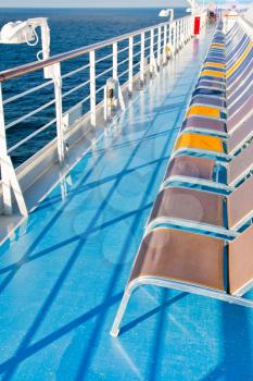 sunbath chairs on side of cruise liner