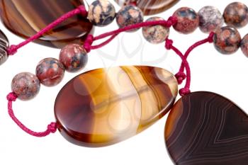 fragment agate lady's bead closeup isolated on white
