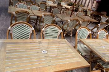 wooden tables and chair in empty street cafe