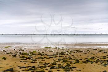 La manche coastline at low tide near Perros-Guirec, Brittany, France in evening