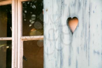 fretwork heart made on wooden shutter