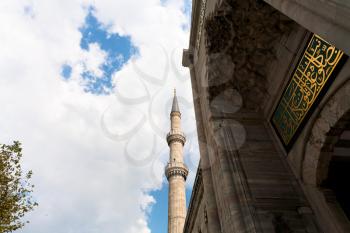 minaret and blue mosque entrance in Istanbul, Turkey