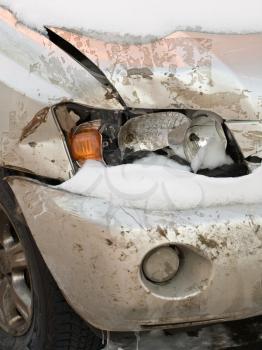 broken headlight on white car