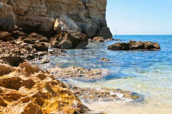 stone Atlantic beach in Algarve, Portugal in summer day