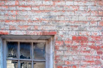 old window in old painted brick wall