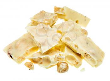 pieces of white chocolate with hazelnuts close up isolated on white background