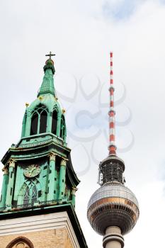 fernsehturm tv tower and st. marys church in Berlin