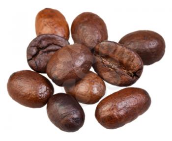 heap of roasted coffee beans isolated on white background