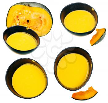 top view on pumpkin soup in black tureen and piece of pumpkin isolated on white background