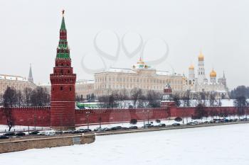 snow in Moscow - view of Grand Kremlin Palace and Kremlin wall and tower in winter