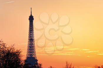 eiffel tower in Paris on yellow warm spring sunset