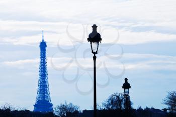 urban lantern and eiffel tower in Paris on blue sunset