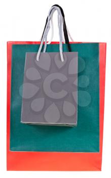 three paper shopping bags isolated on white backgrounds