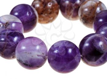 string of round amethyst necklace close up isolated on white background