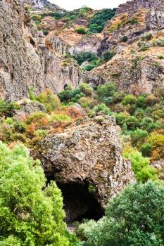 rock cave of ancient Geghard monastery in Armenia in rain