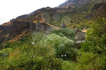 Geghard monastery and cliffs in Armenia. Cliffs surrounding Geghard monastery and Azat river gorge are included together with the monastery in the World Heritage Site listing.