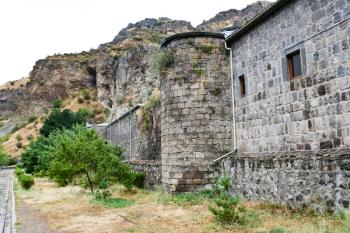 outer stone walls of medieval geghard monastery in Armenia