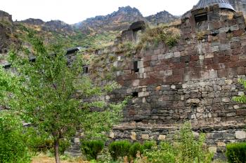 outer ancient stone walls of medieval geghard monastery in Armenia