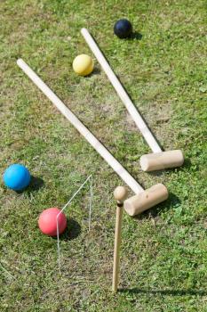 croquet equipment for game of croquet on backyard lawn in summer day