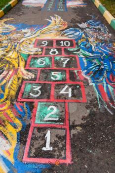 schoolyard Hopscotch court drawn by chalk on pavement