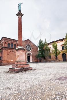 view of column with statue of Saint Dominic and Basilica of San Domenico, Bologna, Italy