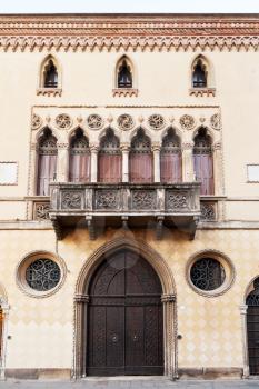 door, balcony of medieval house in Bologna, Italy
